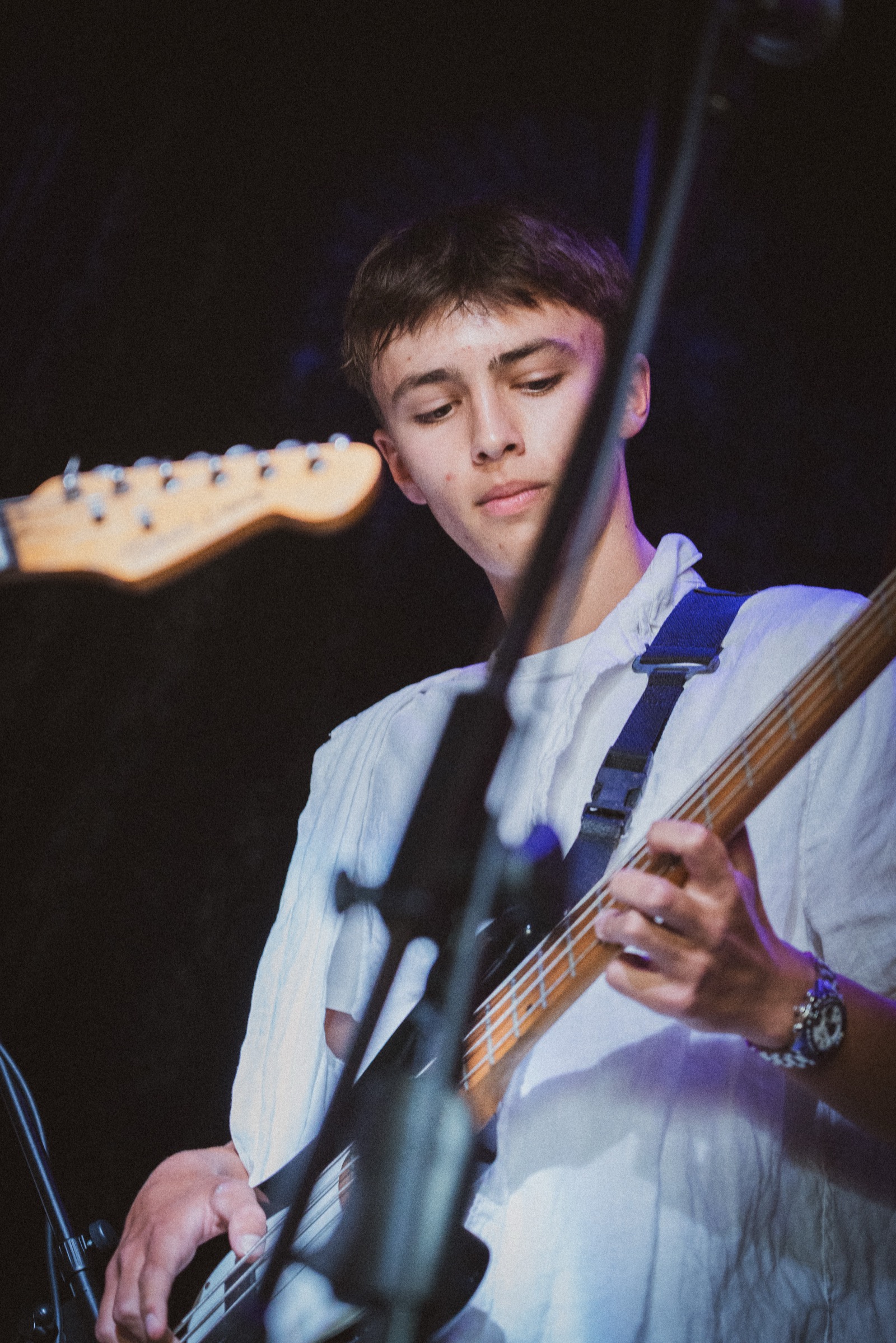 Young bassist performing