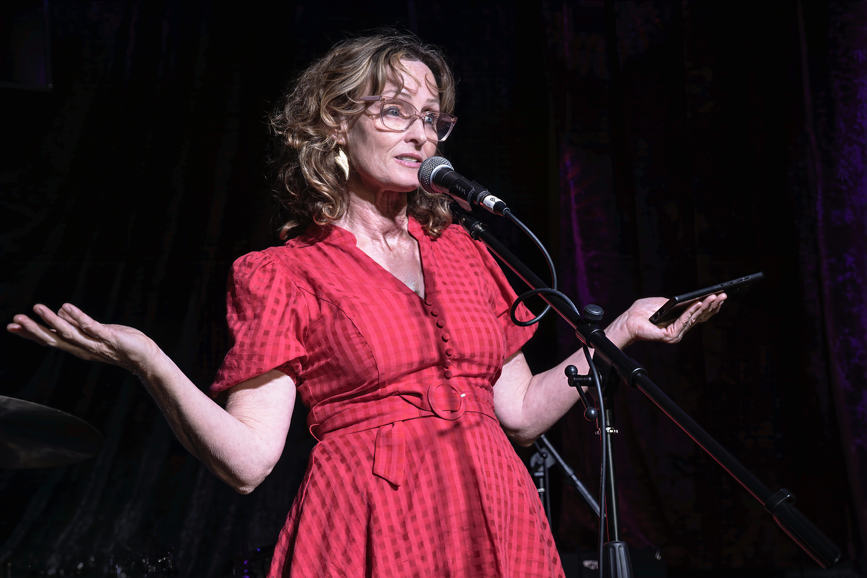 Benita speaking on stage